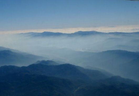 cloud mountains from prop plane back to GC